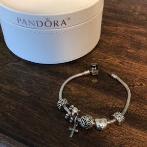 Pandora bracelet with 4 charms and 2 spacers.